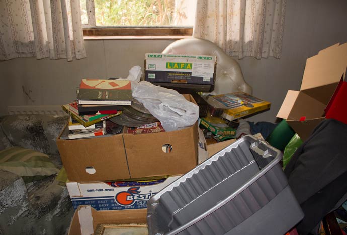 rubbish in bedroom on top of bed